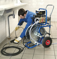 Menlo Park plumbing contractor cleans a drain with a power auger